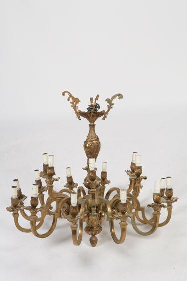 Appraisal: A ROCOCO STYLE BRASS CHANDELIER with a central column with