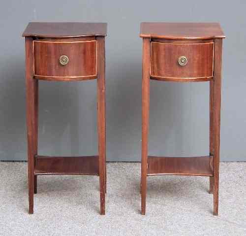 Appraisal: A pair of Edwardian mahogany bow-front bedside tables each fitted