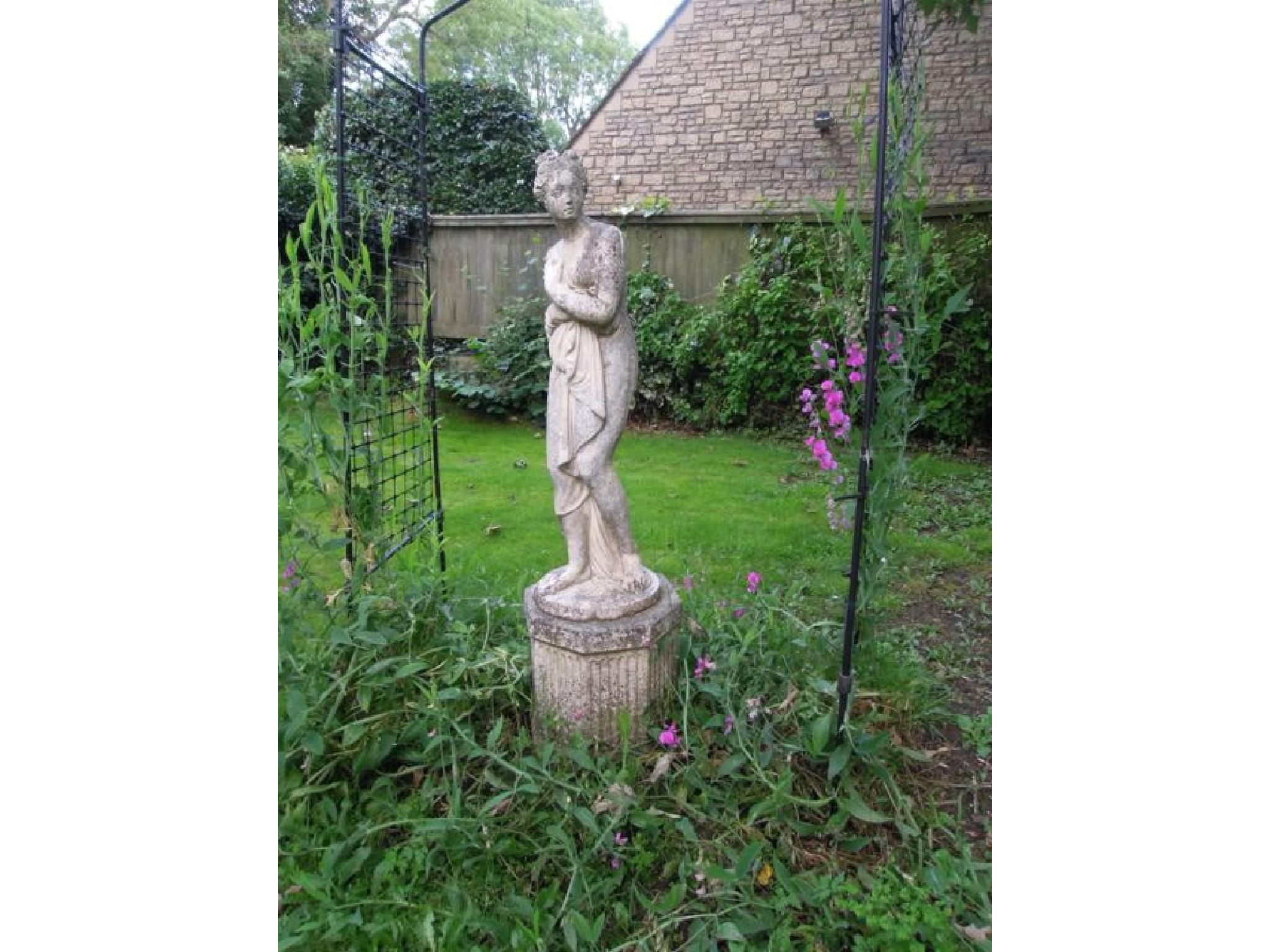 Appraisal: A reconstituted and weathered figure of a classical maiden on