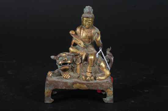 Appraisal: CHINESE GILT BRONZE FIGURAL GROUP OF GUANYIN AND FU LION