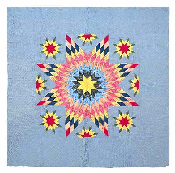 Appraisal: Pennsylvania pieced morning star quilt with a matching crib quilt