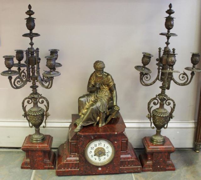 Appraisal: French Piece Garniture Set with Bronze Scholar Includes a pair