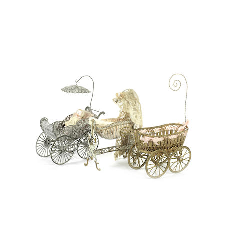 Appraisal: Miniature soft metal dolls carriage The gilt painted filigree carriage