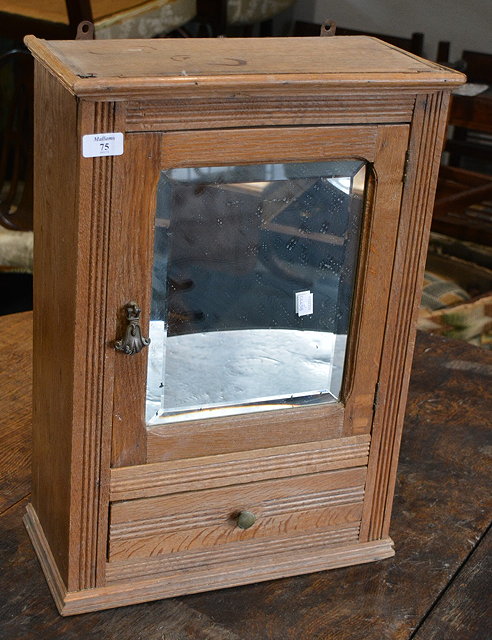 Appraisal: An Edwardian oak bathroom cupboardwith mirrored door and drawer