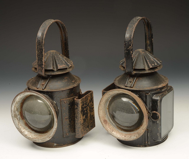 Appraisal: A PAIR OF BLACK PAINTED COMMERCIAL VEHICLE HEAD LAMPS with