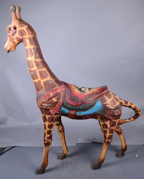 Appraisal: Tall Painted Wooden Giraffe With Saddle This carved wood giraffe