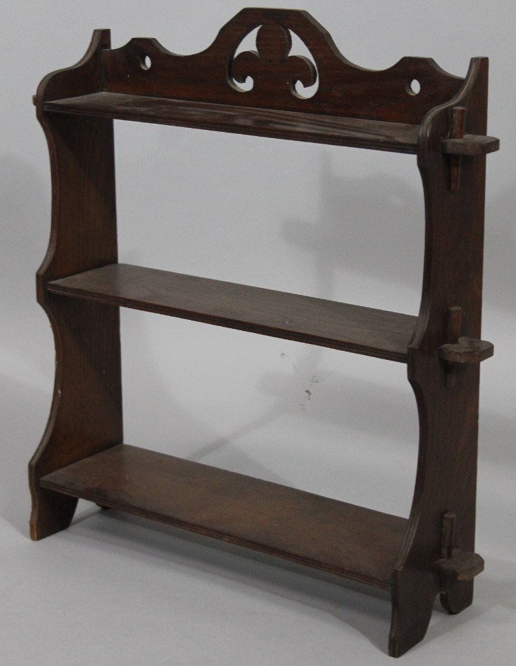 Appraisal: A set of early thC oak shelves centred with a