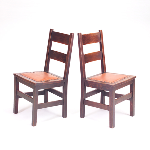 Appraisal: GUSTAV STICKLEY Early pair of ladder-back chairs with V-front seats