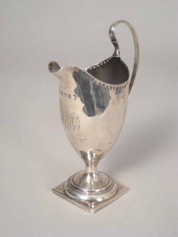 Appraisal: A George III Cream Jug of helmet shape engraved initials