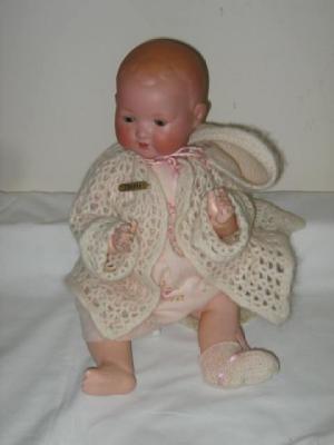 Appraisal: A Heubach bisque head baby doll with brown glass sleeping