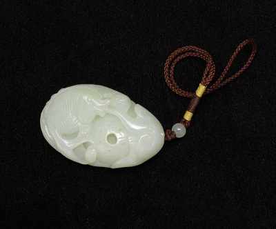 Appraisal: Carved Jade Ornament Oval shape carved with a fish and