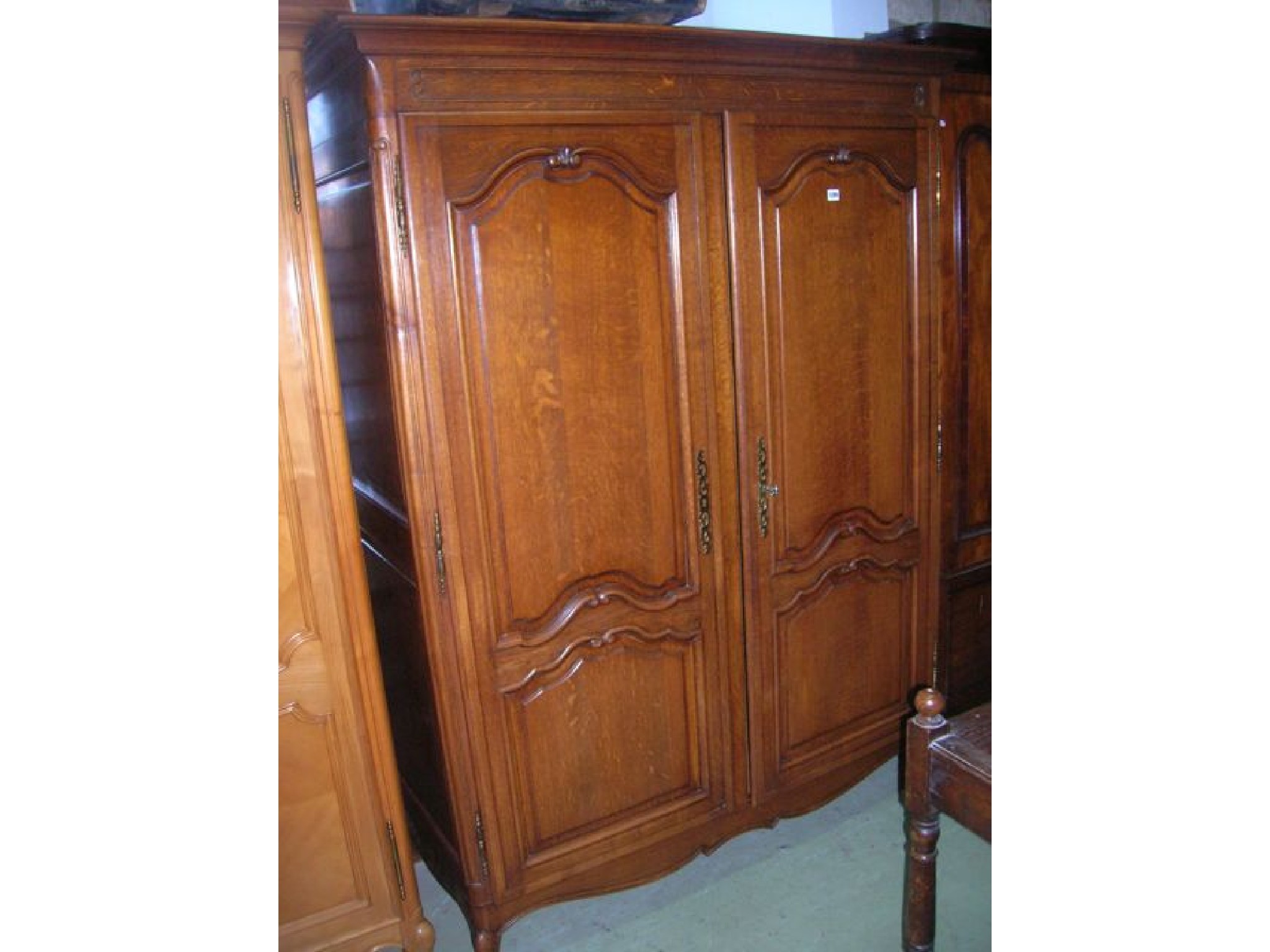 Appraisal: An oak armoire enclosed by a pair of full length