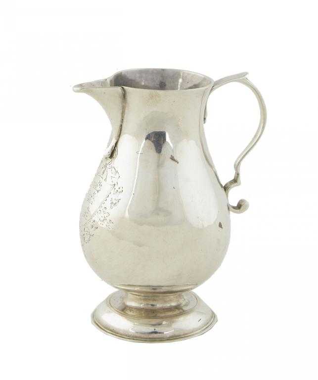 Appraisal: A GEORGE II CREAM JUG of baluster shape engraved with