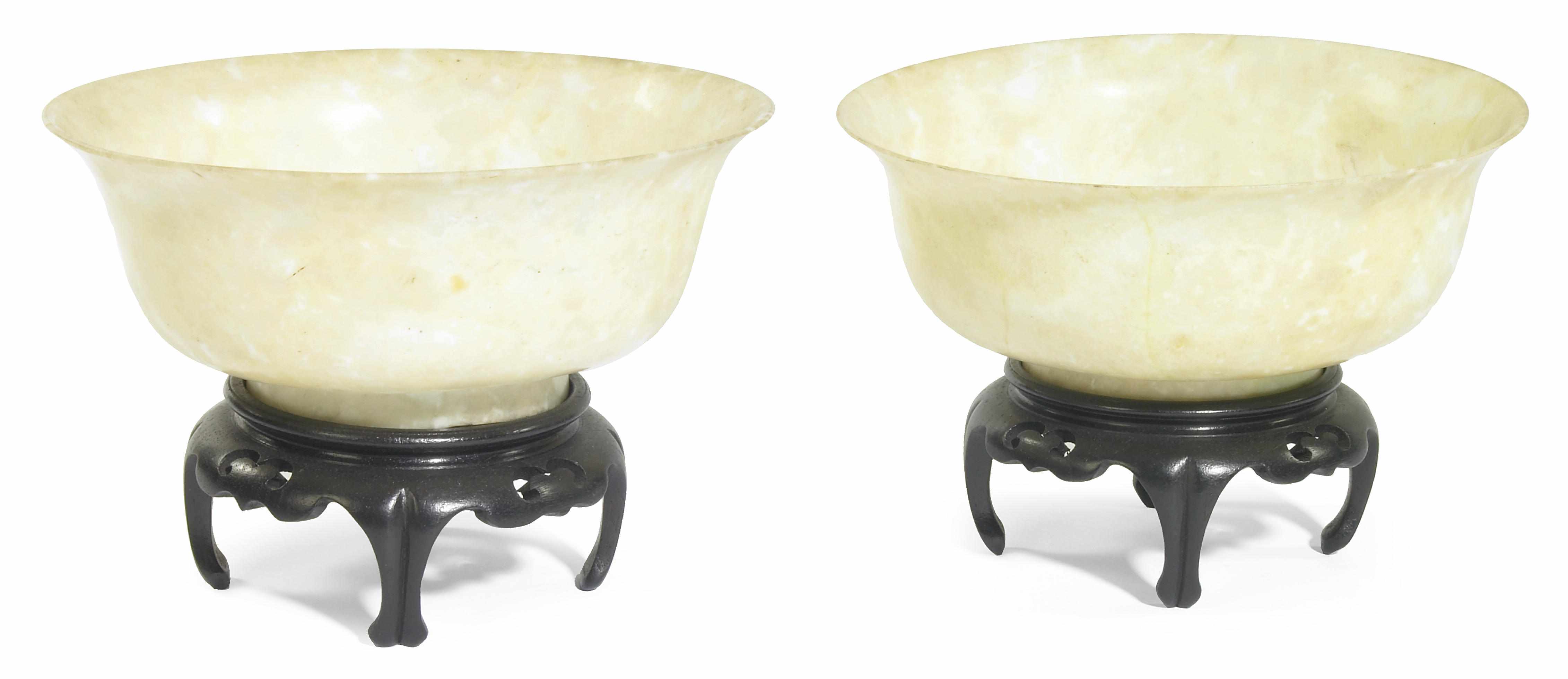 Appraisal: A pair of Chinese white yellow hardstone bowls mottled tone