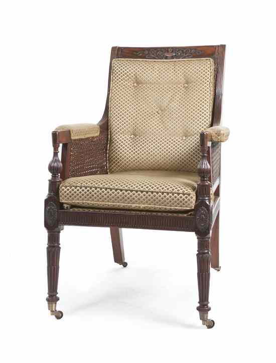 Appraisal: A Regency Caned Armchair having an urn and foliate carved