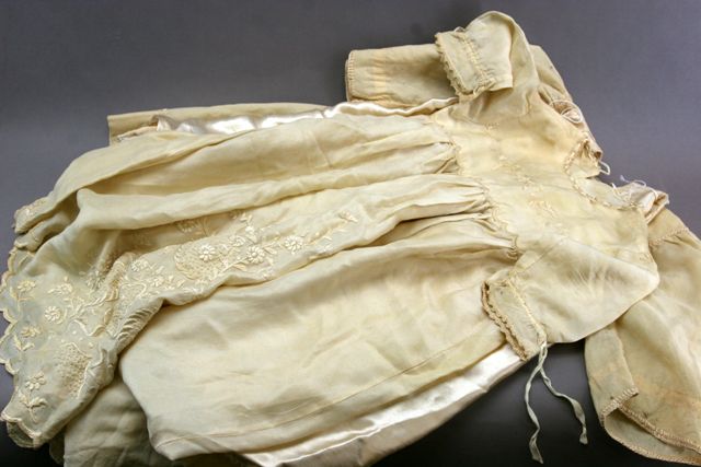 Appraisal: A smocked child's dress together with another and a petticoat