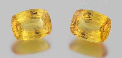 Appraisal: A Pair of Matched Unmounted Yellow Sapphires Mixed cushion cut