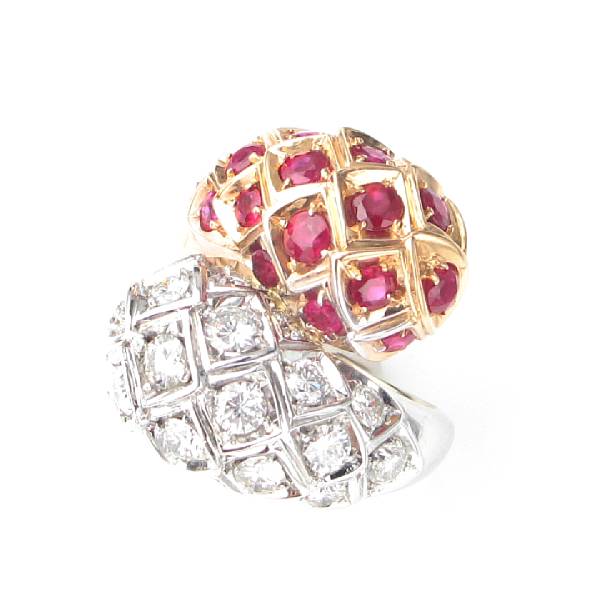 Appraisal: A retro ruby diamond and k two-toned gold by-pass ring