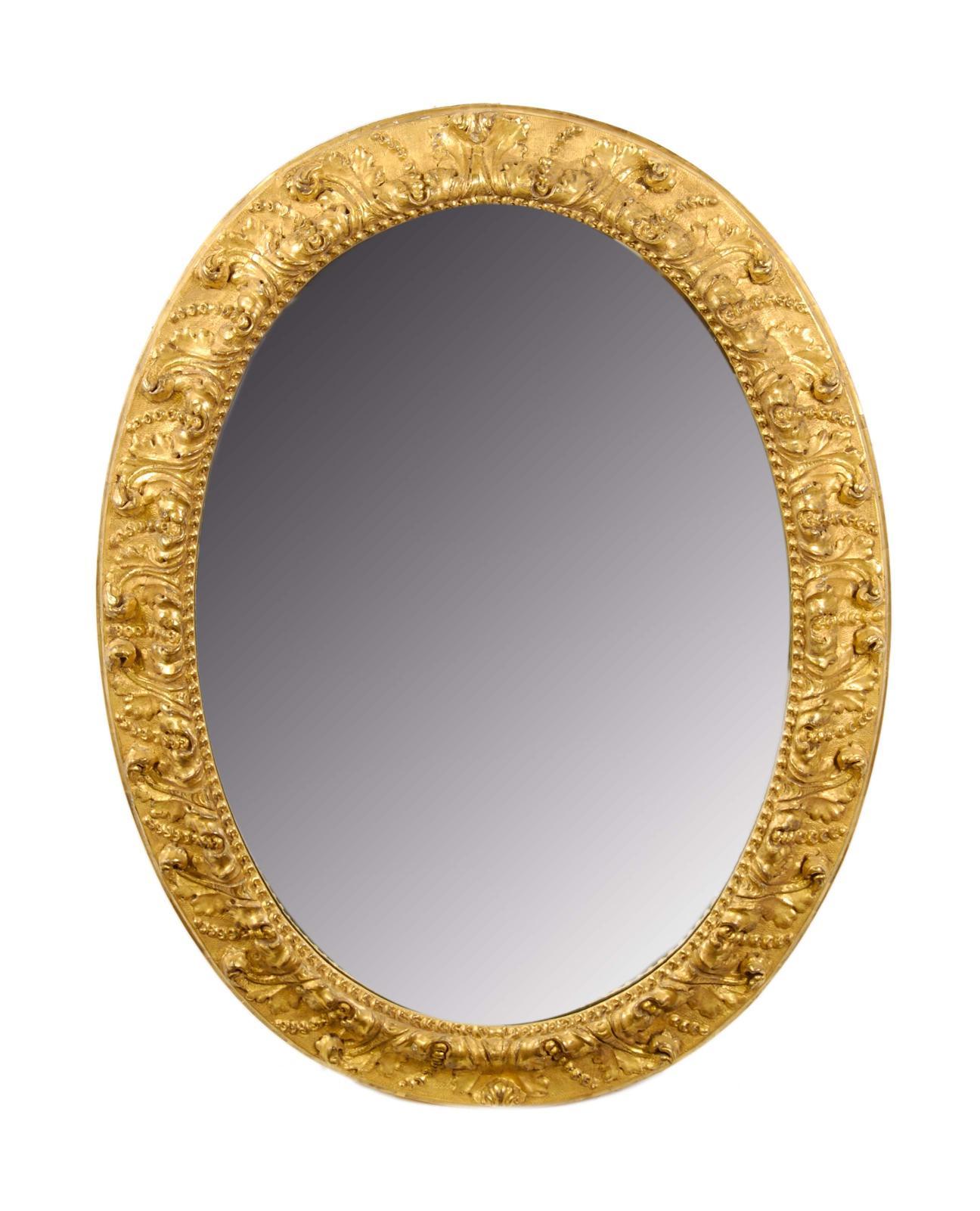 Appraisal: A giltwood and gesso oval wall mirror