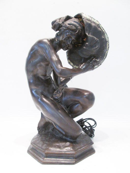 Appraisal: BRONZE FIGURAL TABLE LAMP kneeling figure holding an over-sized nautilus