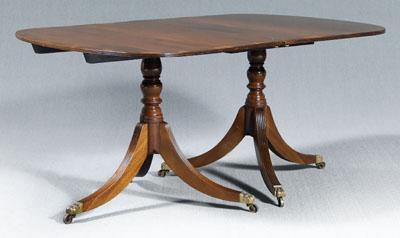 Appraisal: Regency two-pedestal dining table figured mahogany top with fruitwood banding