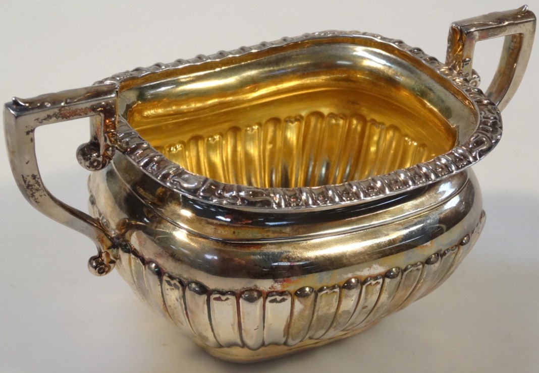 Appraisal: An Edwardian silver two handled sugar bowl by Elkington Co