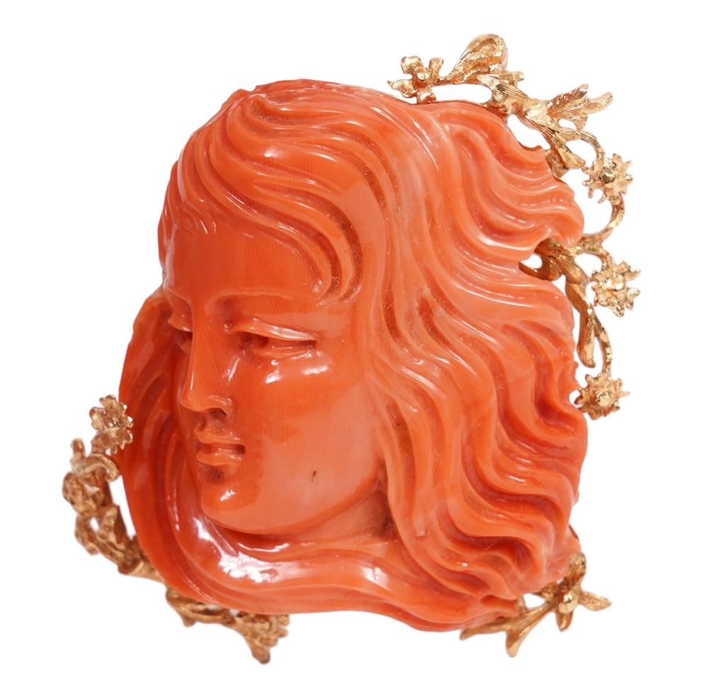 Appraisal: CARVED CORAL GOLD FIGURAL BROOCHCustom made carved salmon coral and