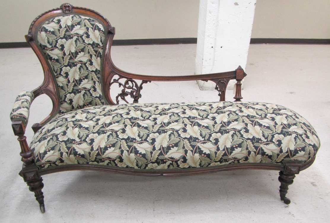 Appraisal: VICTORIAN CHAISE-STYLE SOFA American mid- th century featuring a chair