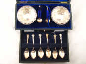 Appraisal: A pair of embossed silver salts with spoons and clear