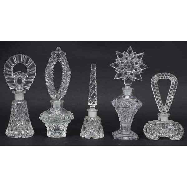 Appraisal: Five Art Deco Pressed Glass Perfume Bottles in Star and