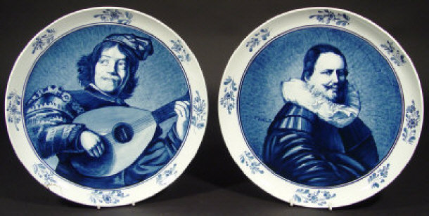 Appraisal: Two Delft pottery wall plates each hand painted in blue