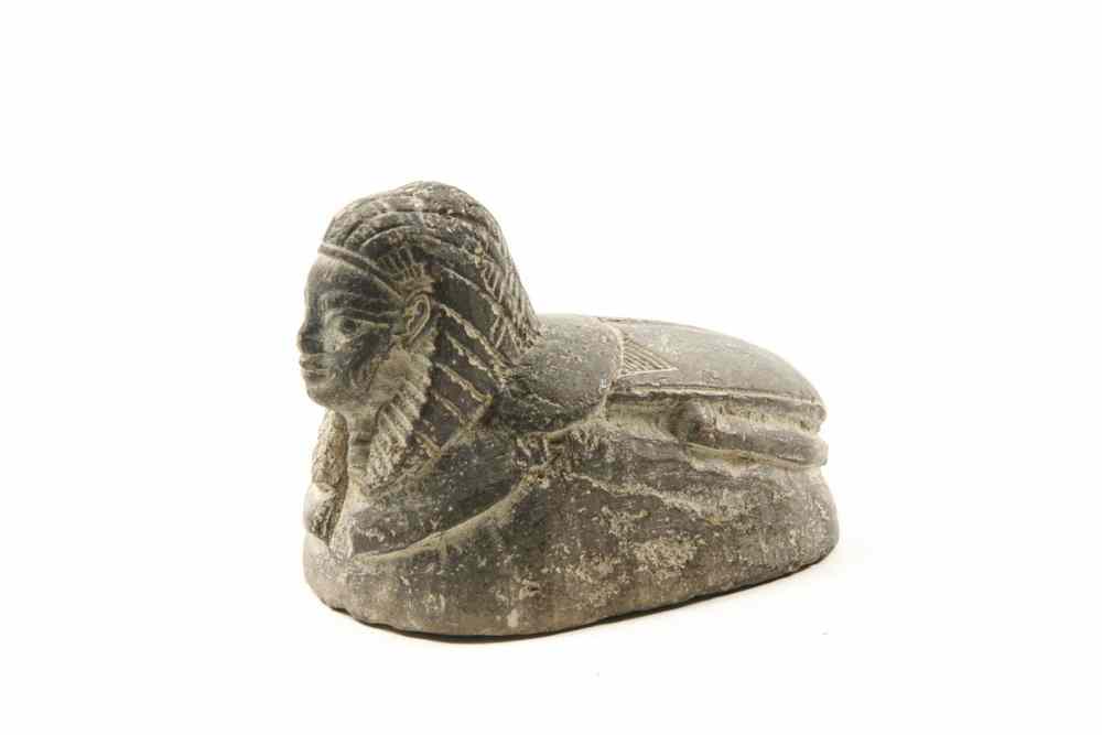 Appraisal: FIGURINE - th c carved Egyptian soft stone sphinx with