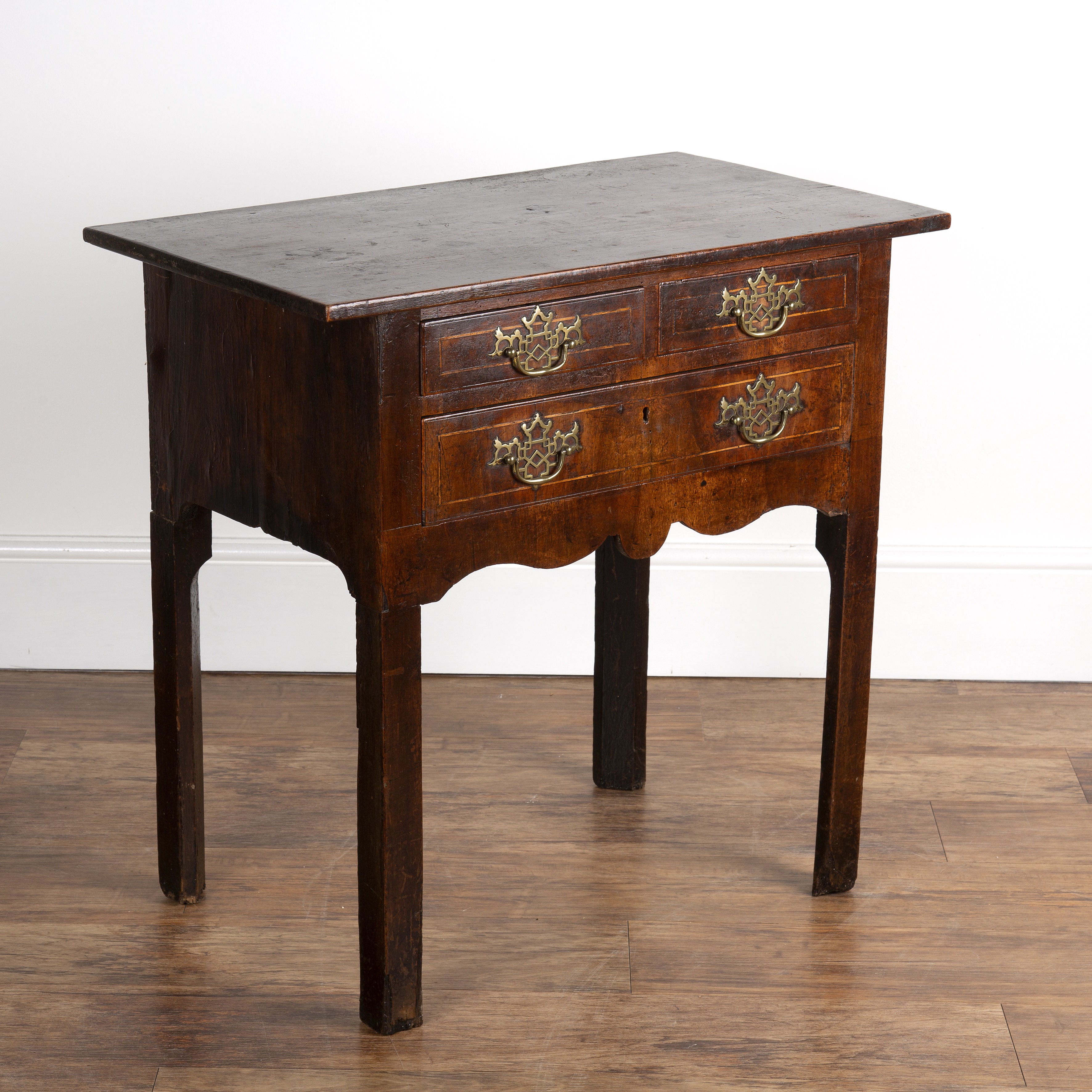 Appraisal: Pine and walnut veneered lowboyfitted two short and one long