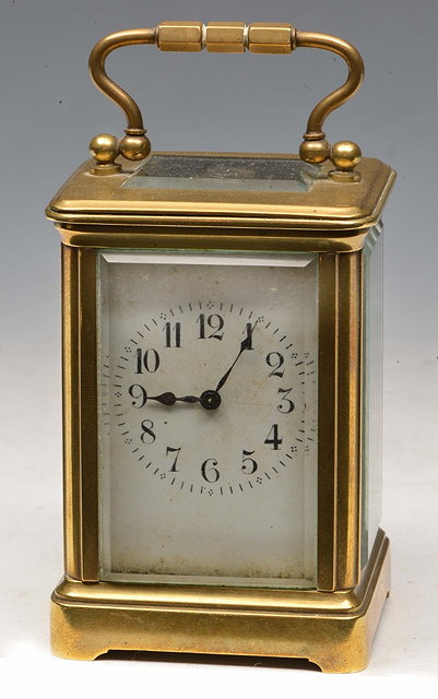 Appraisal: A MINIATURE BRASS CARRIAGE TIMEPIECE with white enamel Arabic dial