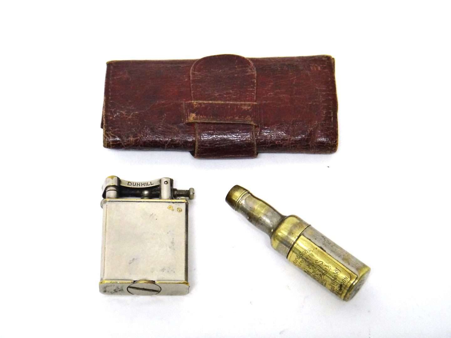 Appraisal: A plated base metal rectangular cased Dunhill petrol lighter a