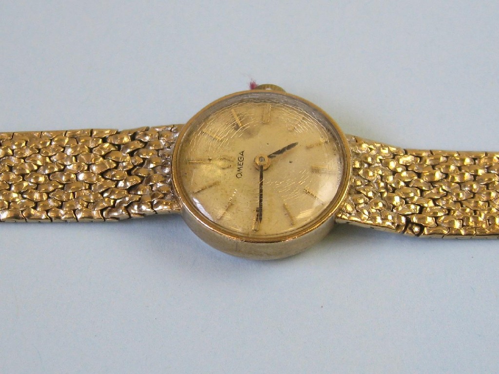 Appraisal: An Omega Lady's Wristwatch the champagne dial with baton numerals