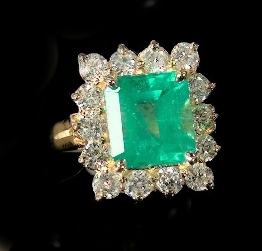 Appraisal: Lady's Fourteen-Karat Yellow Gold Emerald and Diamond Dinner Ring composed