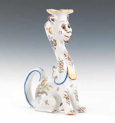 Appraisal: A French Faience Figural Candleholder Feline form candleholder with tail