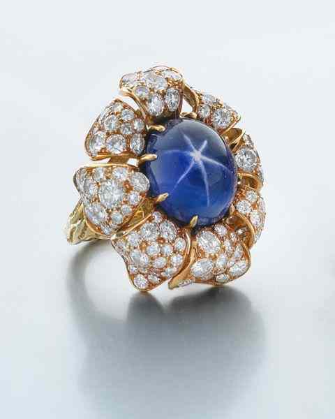 Appraisal: K gold star sapphire GIA and diamond ringfeaturing an oval