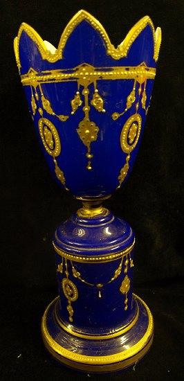 Appraisal: An opaque glass vase the blue ground highlighted in gilt