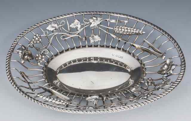 Appraisal: A LATE VICTORIAN SILVER DISH oval shaped with wire work