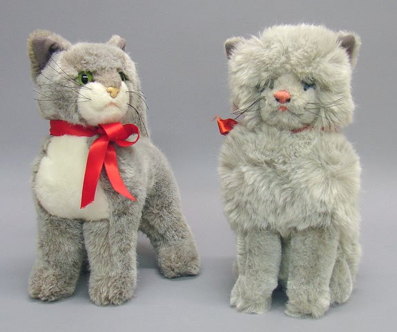 Appraisal: Pair of grey plush cats T Sitting cat has blue