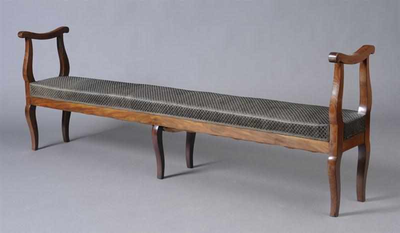 Appraisal: ITALIAN CARVED WALNUT LONG BENCH The rectangular upholstered seat with