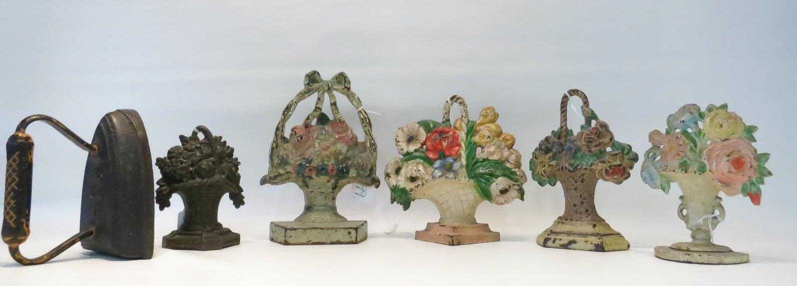 Appraisal: SIX CAST IRON DOOR STOPS in the form of flower