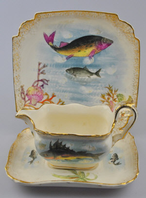 Appraisal: A th century earthenware fish service each piece decorated with