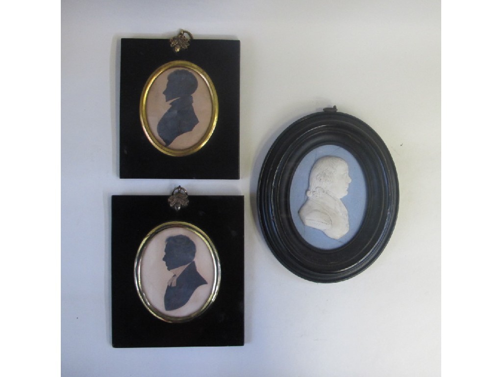 Appraisal: Lot comprising two silhouette portrait prints and a Tassie style