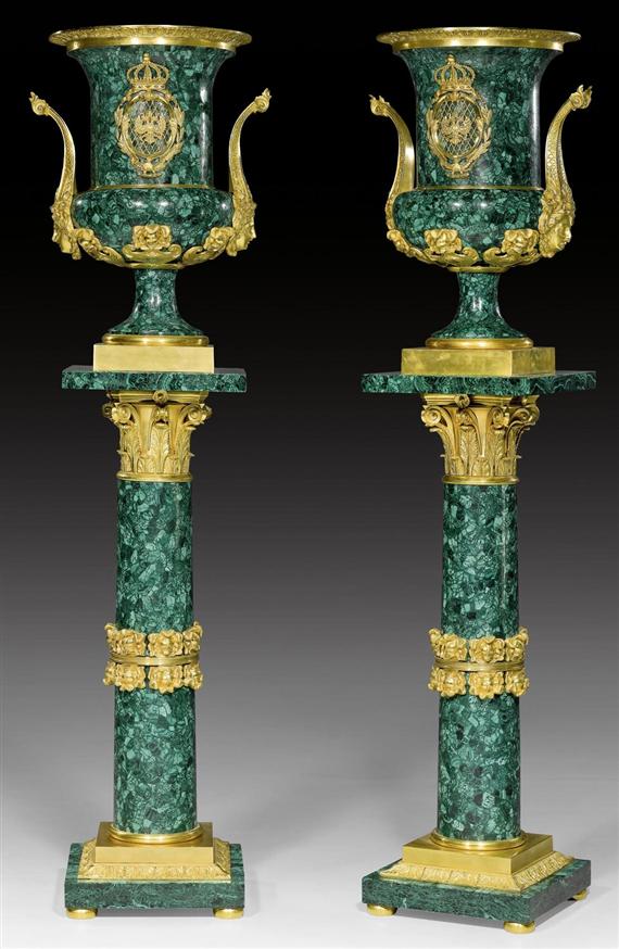 Appraisal: PAIR OF MALACHITE VASES ON COLUMN PEDESTALS Empire style Russia