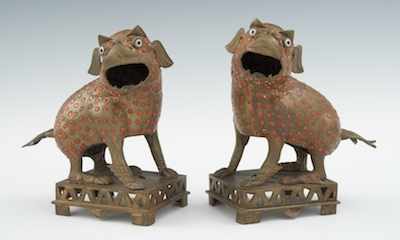 Appraisal: A Pair of Stylized Brass Foo Dogs The animals sit