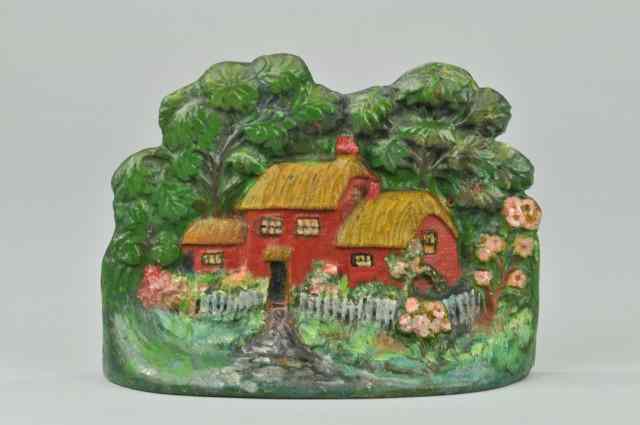 Appraisal: TWO-STORY THATCHED ROOF COTTAGE DOORSTOP ''Crenier Novelties No '' inscribed