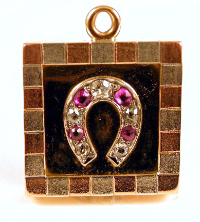 Appraisal: RUBY DIAMOND AND FOURTEEN KARAT GOLD PENDANT the square shaped